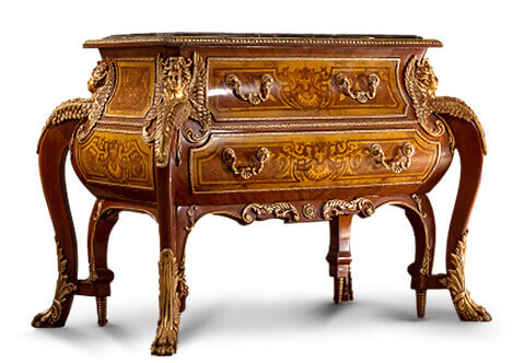 A fine reproduced Louis XIV style ormolu mounted cut brass and tortoiseshell inlaid Boulle commode after the model by André-Charles Boulle in brown version applied with fine marquetry and wood veneers.